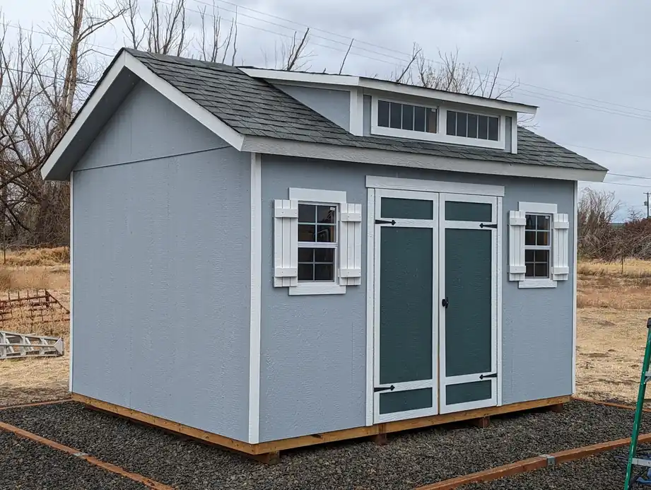 Painted shed in blue grey with white trim
