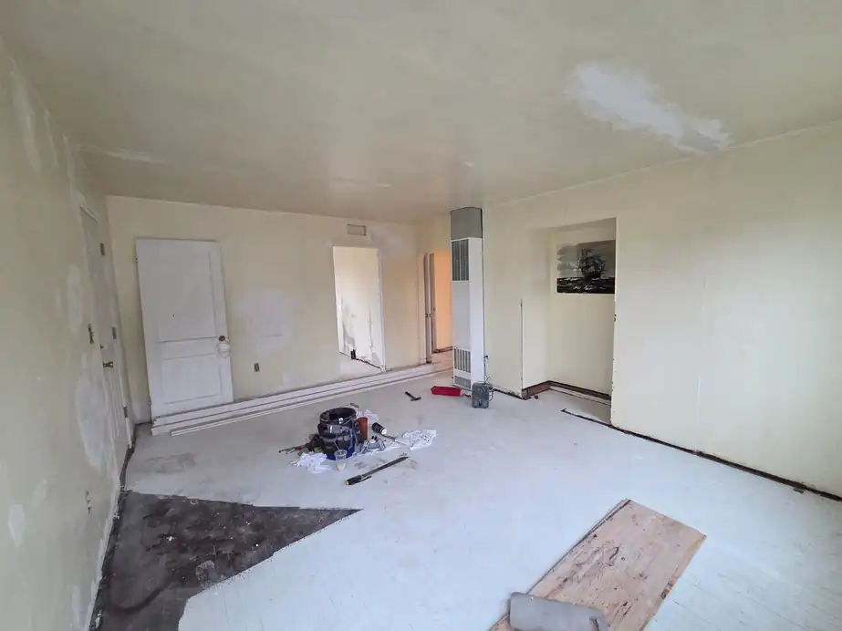 Interior room mid preparation with patched areas visible on the walls