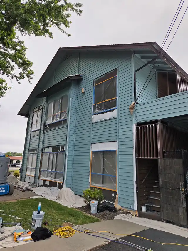 Commercial building with windows and doors masked in plastic ready for spraying